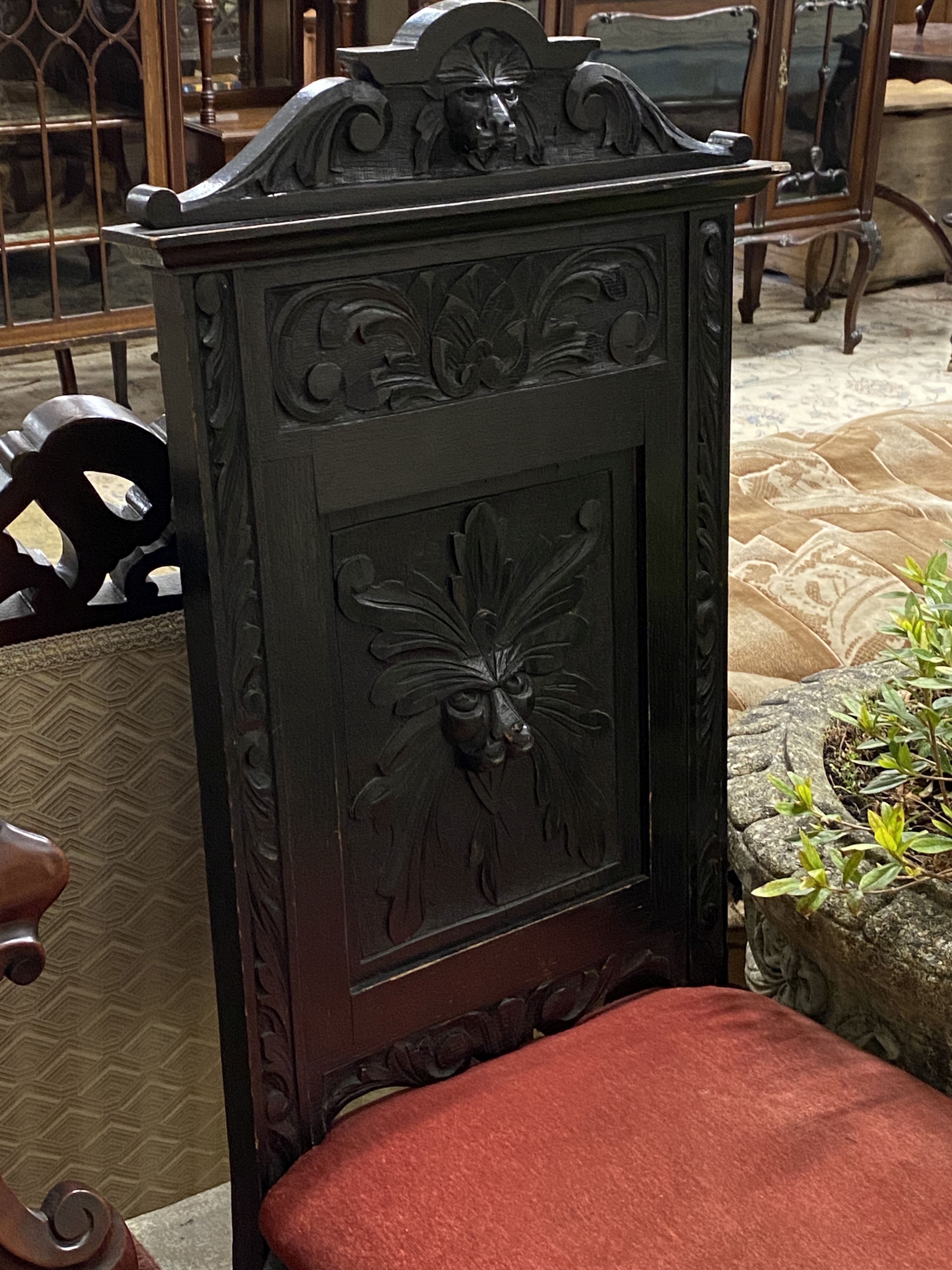 A Victorian mahogany hall chair and a Flemish carved oak dining chair